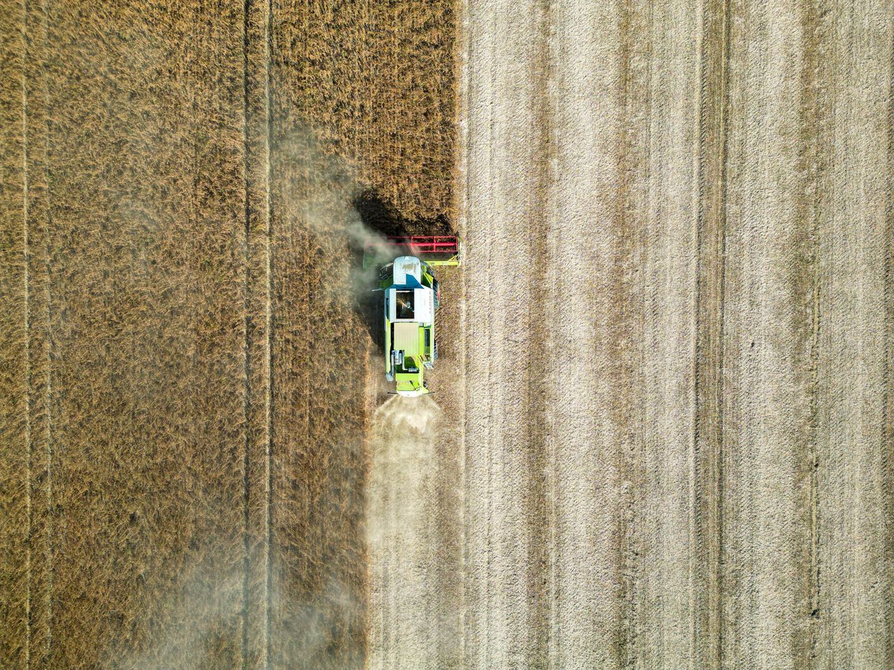 Mastering the First Impression: Your intriguing post title goes here Drone shot of a combine harvester working in a wheat field in Garešnica, Croatia.